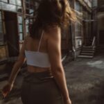 Woman walking confidently symbolizing freedom from corporate burnout to digital entrepreneurship through mindful marketing.