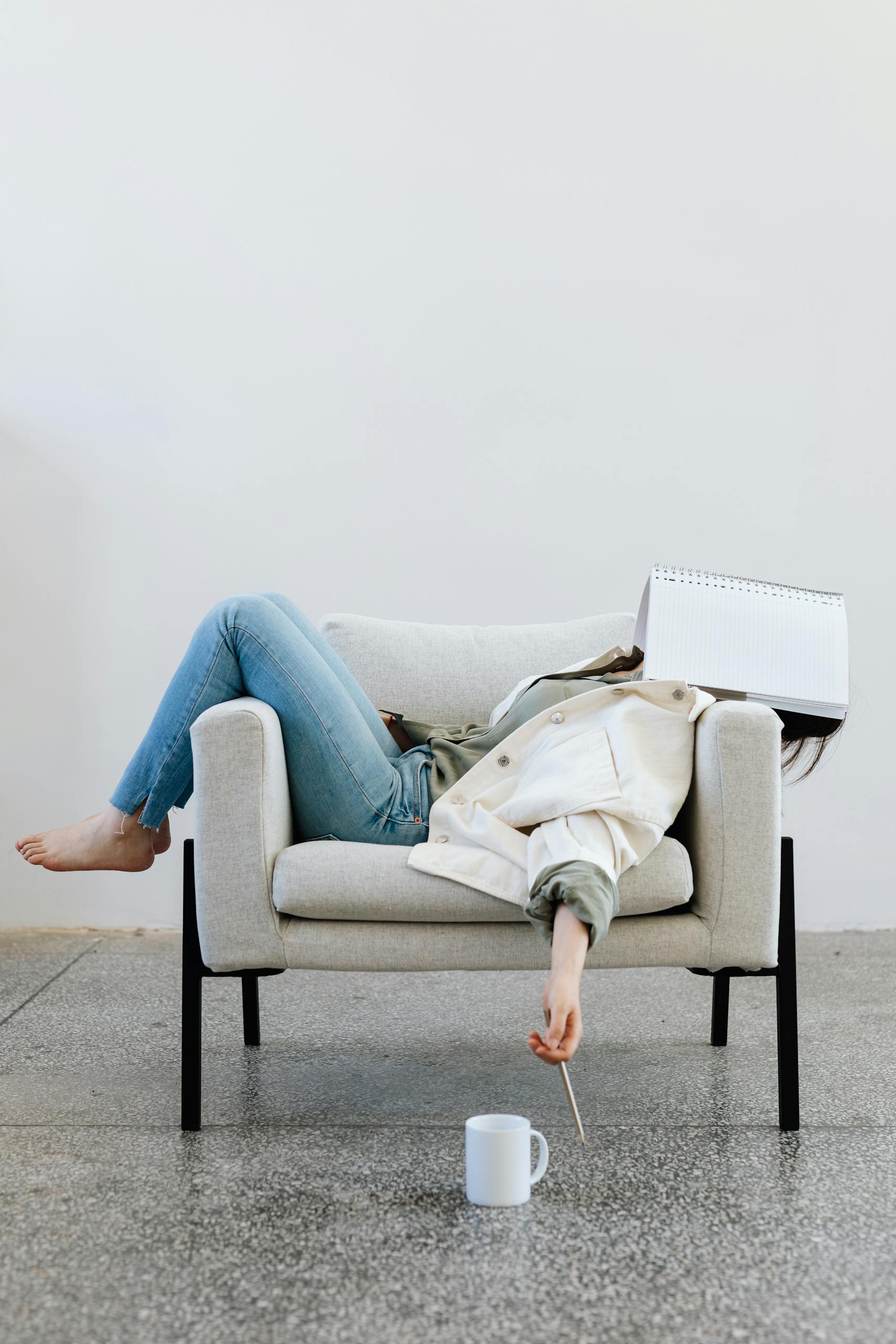 Woman collapsed on a chair in casual clothes, symbolizing emotional exhaustion, burnout, and the quiet moment of realizing it’s time for something new.