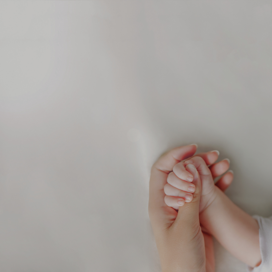 baby and mom hands